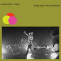 the album cover for IDLES - A Beautiful Thing: IDLES Live at Le Bataclan [Neon Clear Lime Green 2LP]