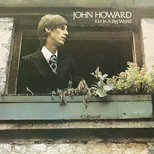the album cover for John Howard - Kid In A Big World