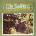the album cover for Glen Campbell - Too Late To Worry - Too Blue To Cry
