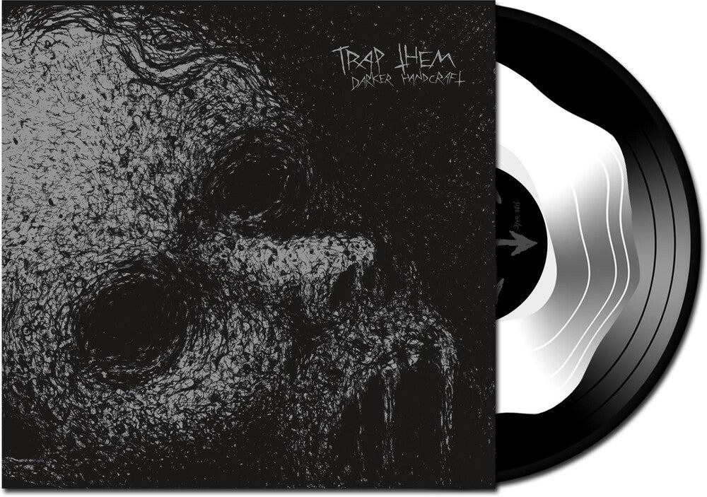 the album cover for Trap Them - Darker Handcraft