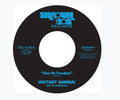 the album cover for Instant Karma! - Give Me Freedom / Shine On