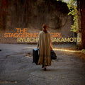 the album cover for Ryuichi Sakamoto - Staggering Girl / O.S.T. (Uk)