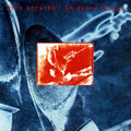 the album cover for Dire Straits - On Every Street [Brick & Mortar Exclusive]