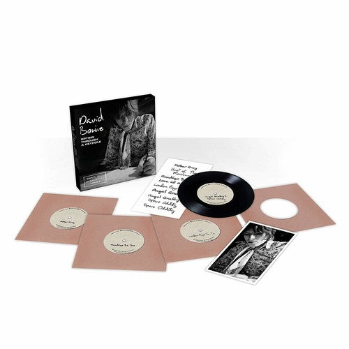 the album cover for David Bowie - Spying Through A Keyhole [7in Vinyl Box Set]