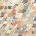 the album cover for Bad Books - Bad Books (Cream with Orange, Yellow, Blue Splatter)