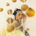 the album cover for Japanese Breakfast - Jubilee [Indie Exclusive Limited Edition Clear with Yellow Swirl LP]