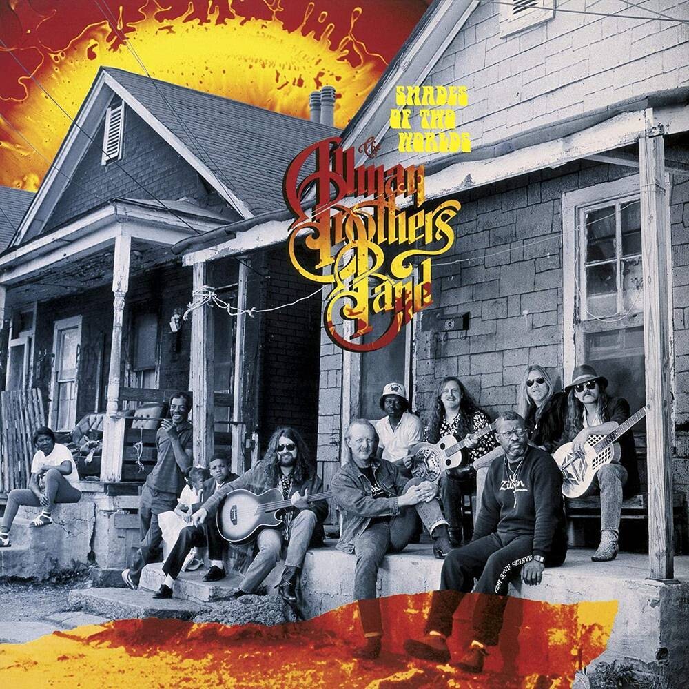 the album cover for The Allman Brothers Band - Shades Of Two Worlds [Limited Edition 180 Gram Orange & Red Swirl Audiophile LP]