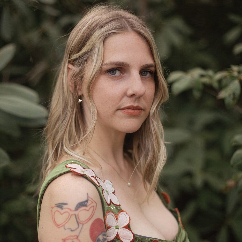 the album cover for Dori Freeman - Ten Thousand Roses