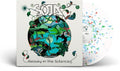 the album cover for SOJA - Beauty In The Silence [Limited Edition White with Green/Blue/Red Splatter LP]