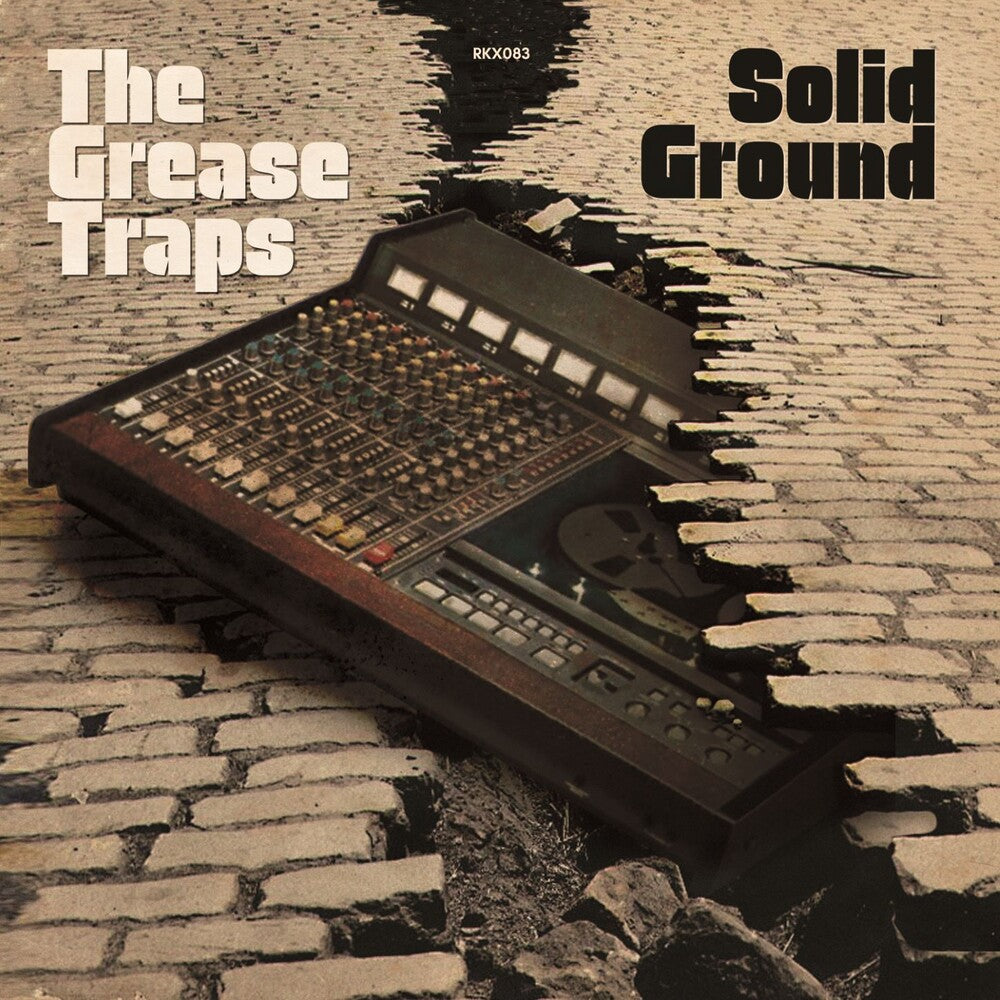the album cover for Grease Traps - Solid Ground