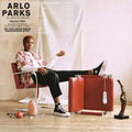 the album cover for Arlo Parks - Collapsed In Sunbeams (Blue Vinyl) (Blue) [Colored Vinyl]