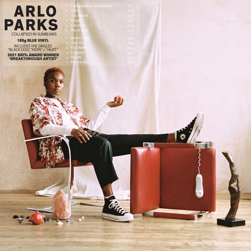 the album cover for Arlo Parks - Collapsed In Sunbeams (Blue Vinyl) (Blue) [Colored Vinyl]