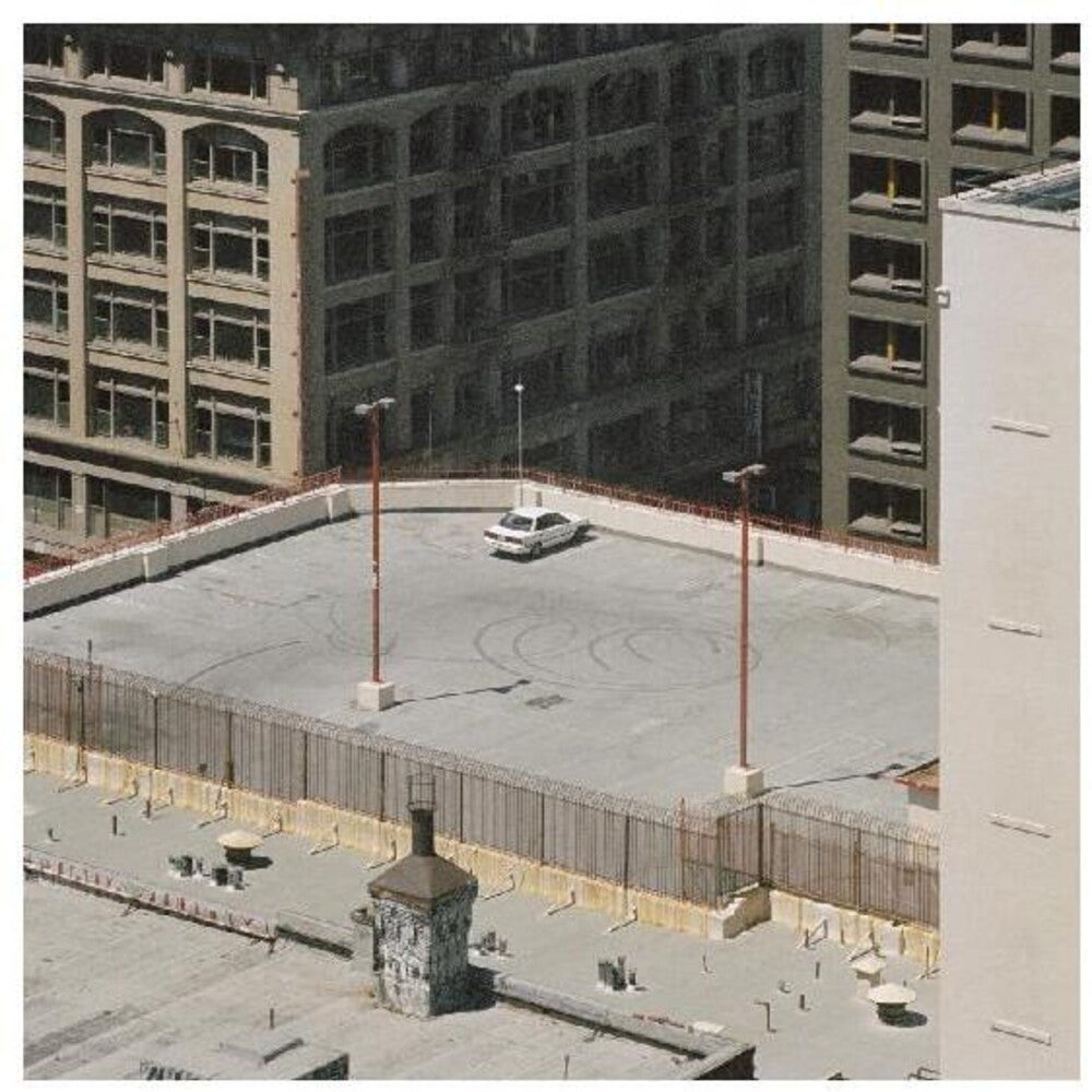the album cover for Arctic Monkeys - The Car [Indie Exclusive Limited Edition Custard LP]