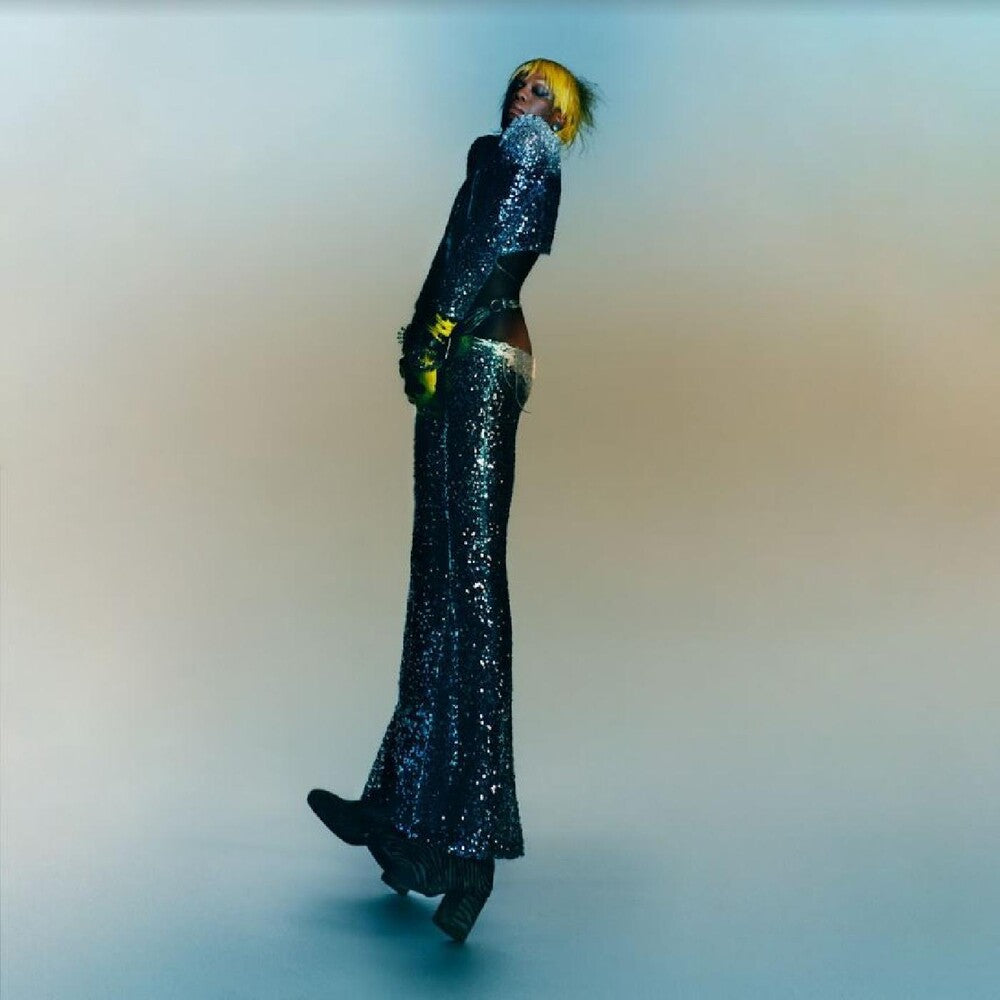 the album cover for Yves Tumor - Praise A Lord Who Chews But Which Does Not Consume; (Or Simply, Hot Between Worlds) [45RPM 2LP]