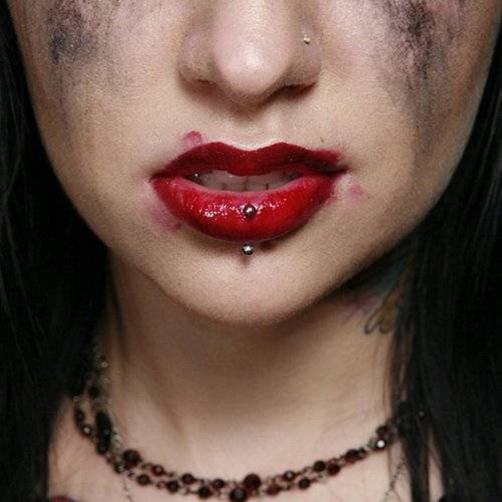 the album cover for Escape The Fate - Dying Is Your Latest Fashion:15th Anniversary Edition [Indie Exclusive Limited Edition Opaque Red LP]
