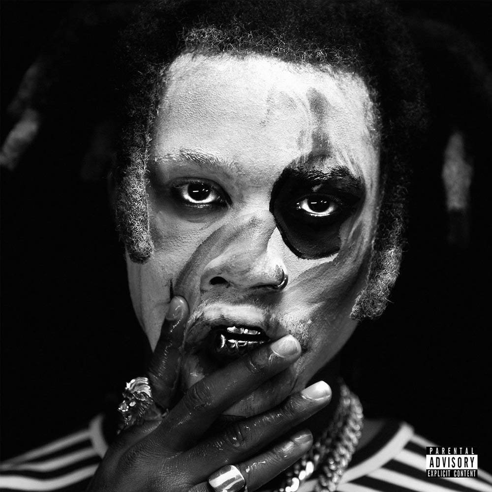 the album cover for Denzel Curry - TA13OO [Indie Exclusive Limited Edition Magenta Splash LP]