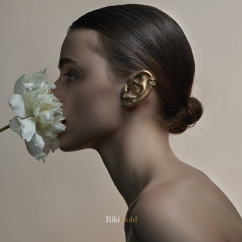 the album cover for Riki - Gold [Red in Clear LP]
