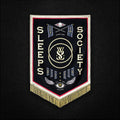 the album cover for While She Sleeps - SLEEPS SOCIETY [Limited Edition Glow In The Dark LP]
