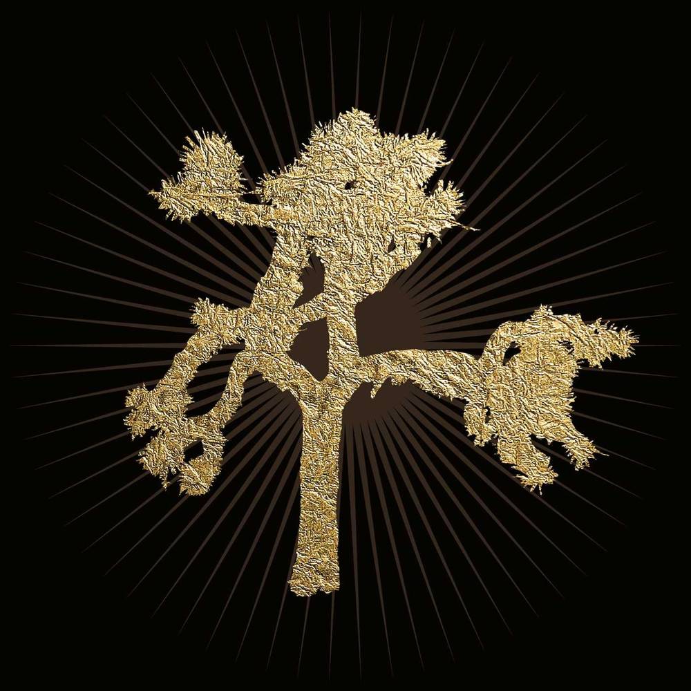 the album cover for U2 - The Joshua Tree [30th Anniversary Limited Edition Gold 2LP]