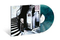 the album cover for Mazzy Star - She Hangs Brightly -  [RSD Essential Aqua & Black Marble LP]