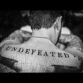 the album cover for Frank Turner - UNDEFEATED [Indie Exclusive Purple LP]