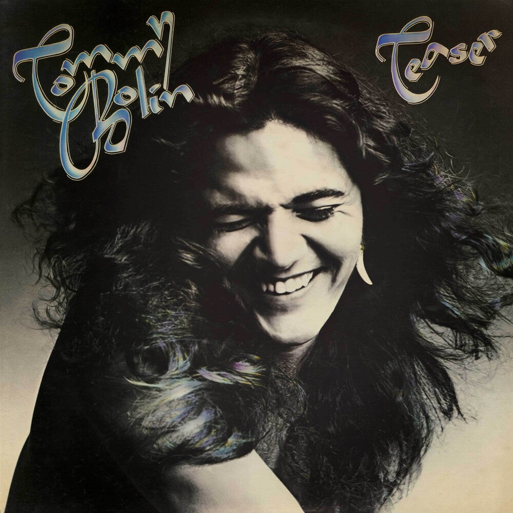 the album cover for Tommy Bolin - Teaser - Blue/Black/White Splatter (Blk) (Blue)