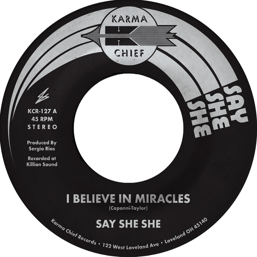 the album cover for Say She She - I Believe In Miracles / C'est Si Bon [Colored Vinyl]