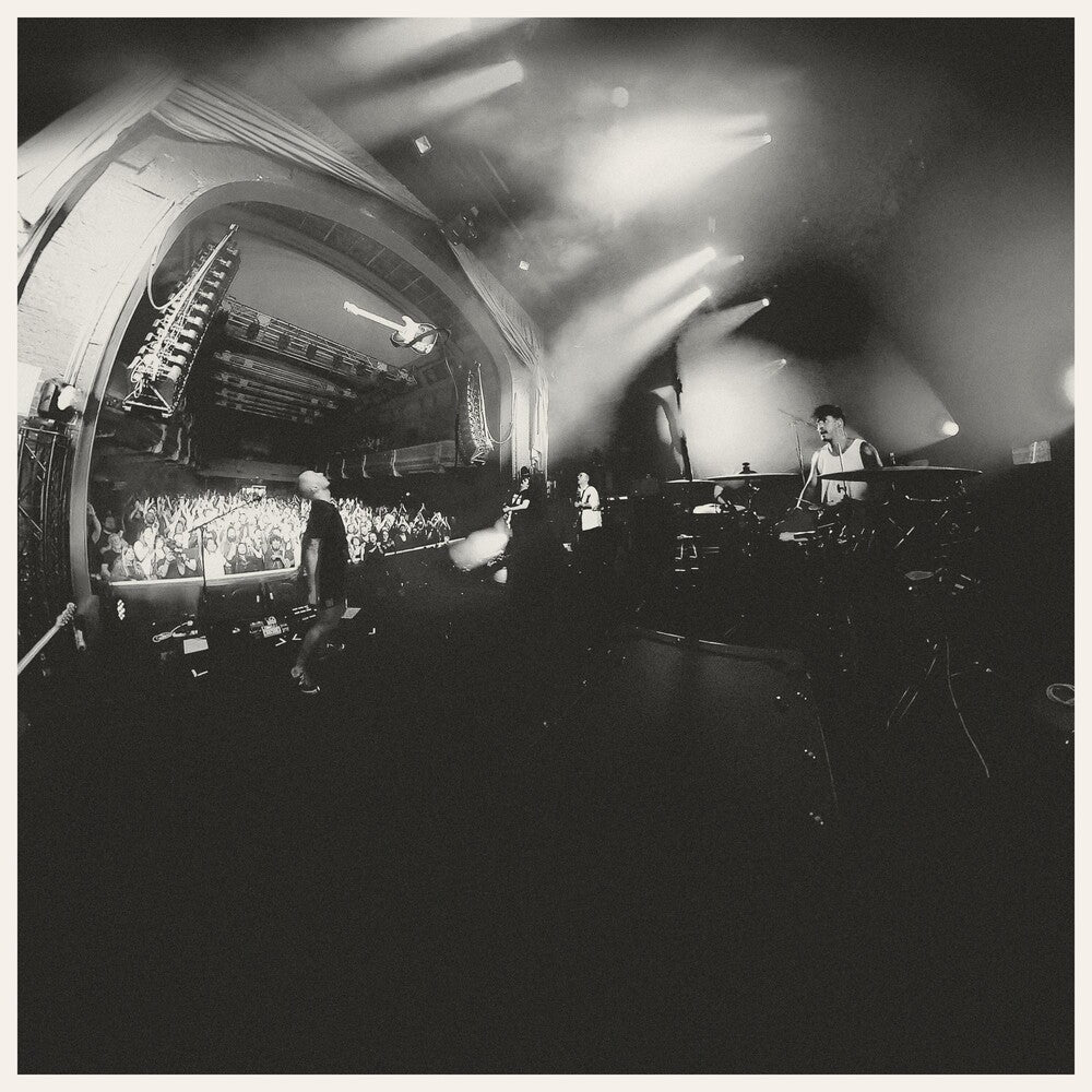 the album cover for And So I Watch You From Afar - Megafauna