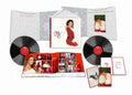 the album cover for Mariah Carey - Merry Christmas (30th Anniversary)