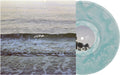 the album cover for Copeland - Ixora [Indie Exclusive] Clear & Light Blue Ghostly (Blue)