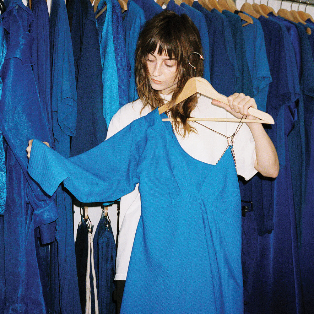 the album cover for Faye Webster - Underdressed At The Symphony (Blue) [Colored Vinyl] (Wht)