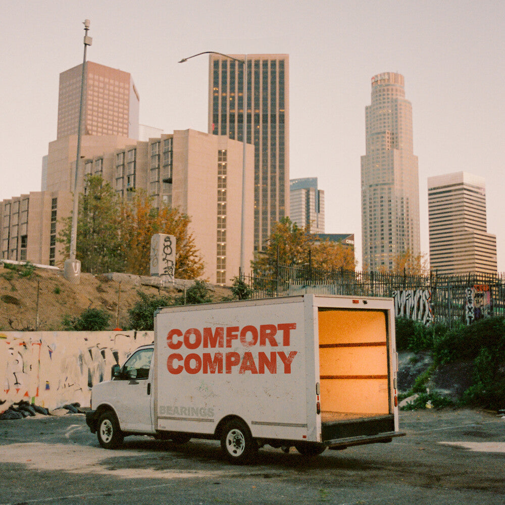 the album cover for Bearings - Comfort Company [Indie Exclusive Half Baby Pink / Half Red w/ white splatter LP]