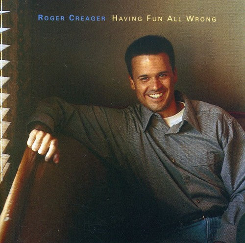 the album cover for Roger Creager - Having Fun All Wrong