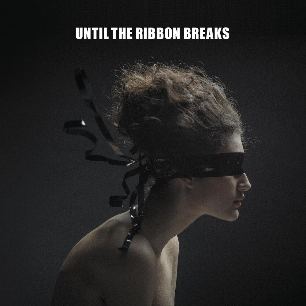 the album cover for Until The Ribbon Breaks - A Lesson Unlearnt