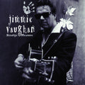 the album cover for Jimmie Vaughan - Strange Pleasure