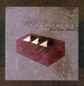 the album cover for Small Brown Bike - Our Own Wars