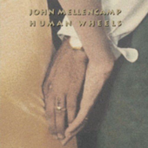 the album cover for John Mellencamp - Human Wheels [Remastered]