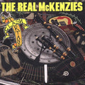 the album cover for The Real Mckenzies - Clash of the Tartans