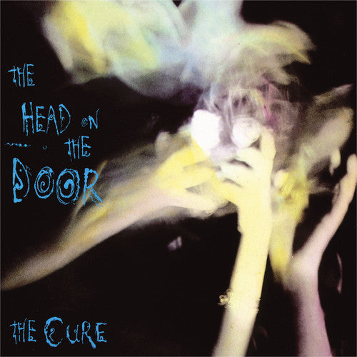 the album cover for The Cure - Head on the Door