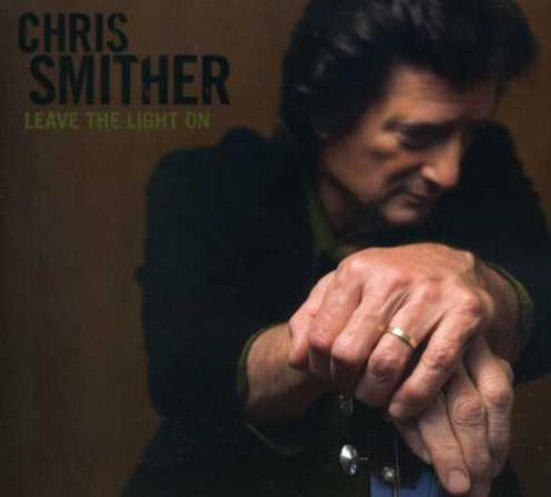 the album cover for Chris Smither - Leave the Light on